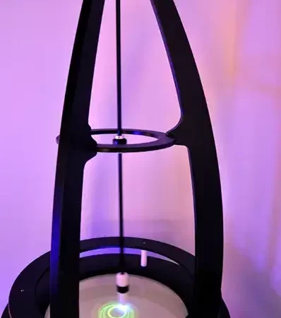 a light pendulum suspended over a rotating platter of phosphorescent material