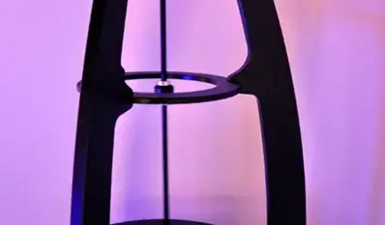 a light pendulum suspended over a rotating platter of phosphorescent material